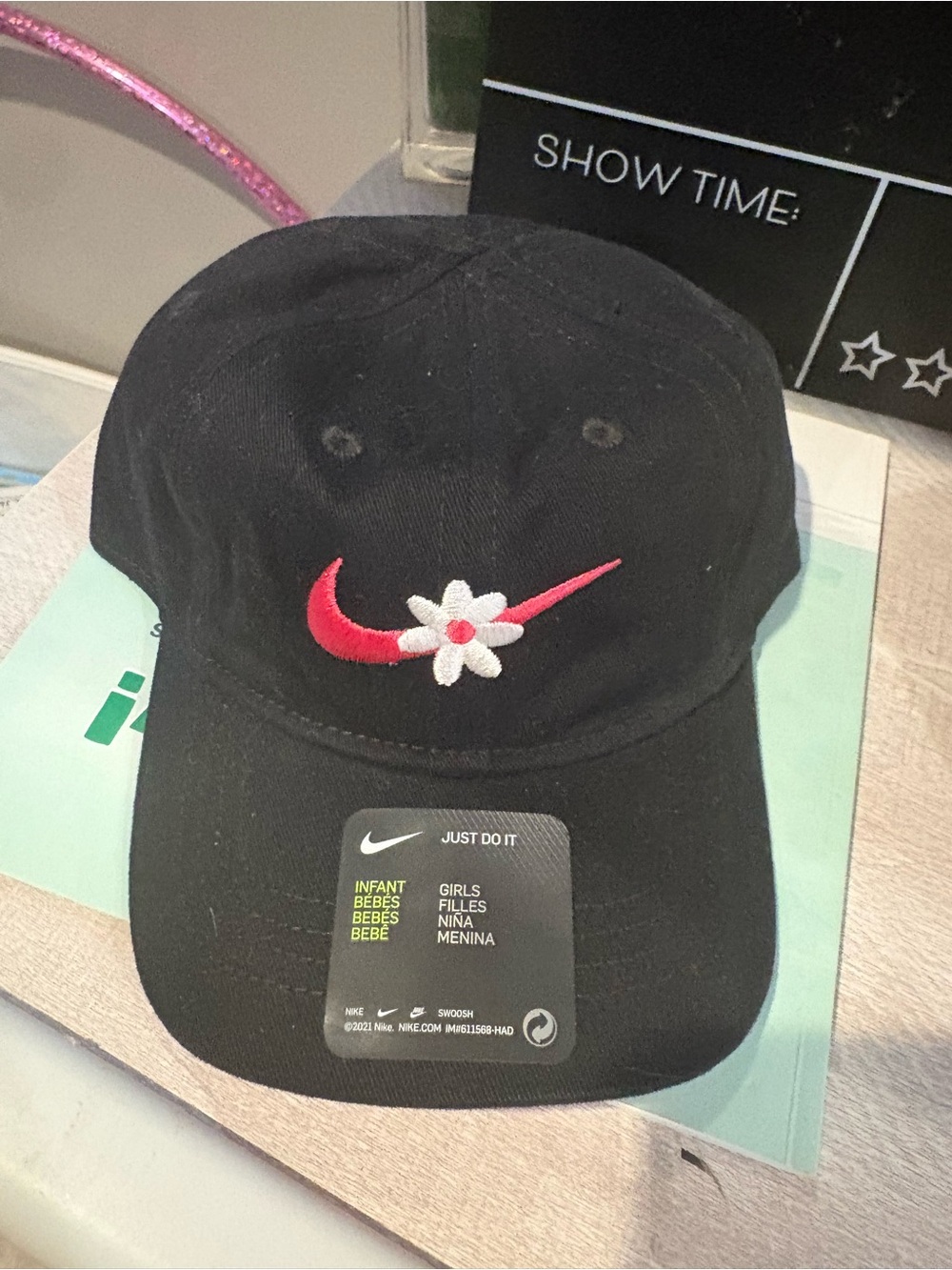Nike infant Black Cap with Pink Swoosh and White Flower Accent